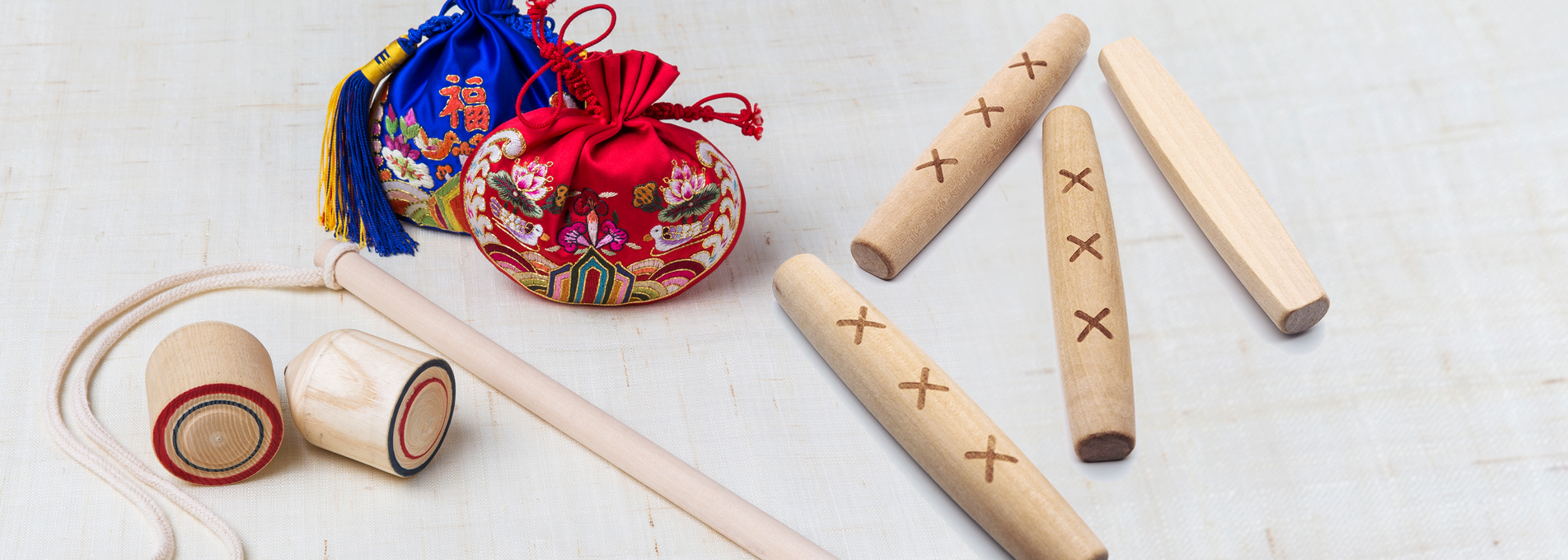 Bokjumeoni and yunnori (lucky bag and yut game)